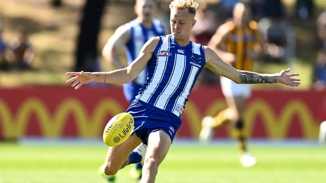 MELBOURNE, AUSTRALIA - MARCH 06: Jaidyn Stephenson of the Kangaroos kicks during the AFL Community Series match between the Hawthorn Hawks and the North Melbourne Kangaroos at Arden Street Ground on March 06, 2021 in Melbourne, Australia. (Photo by Quinn Rooney/Getty Images)