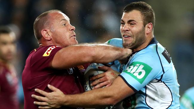 QLD's Matt Scott tackled by NSW's Wade Graham during game 3 of the 2016 Origin series between the NSW Blues and the Queensland Maroons at ANZ Stadium , Homebush .Picture : Gregg Porteous