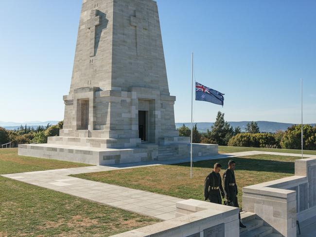 Turkish soldiers walk past the Lone Pine monument in Gallipoli. Picture: Bradley Secker