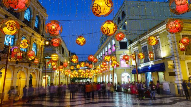 Asian-style lanterns and European-style architecture meet in Senado Square, Macau. 