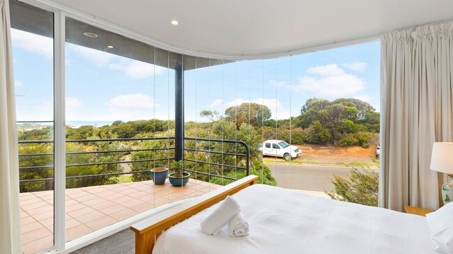 This bedroom looks out to the beach.