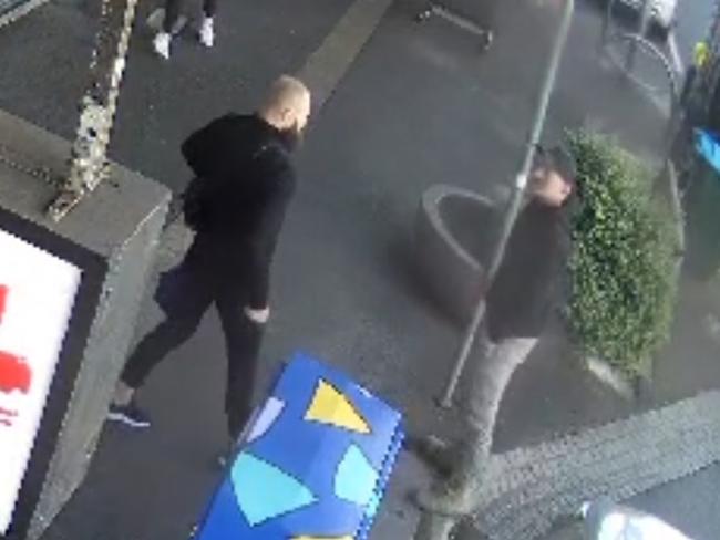 Daniel Clavell in all black is seen on CCTV walking up Puckle St Moonee Ponds allegedly carrying a weapon and threatening people on the street. Picture: Supplied