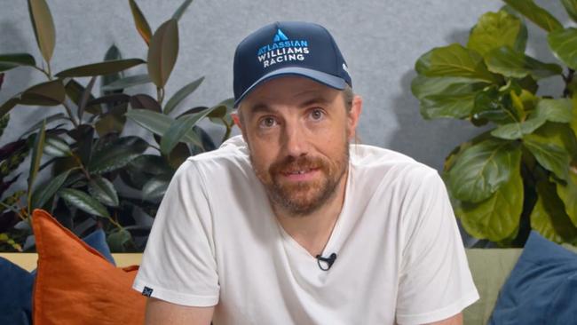 Atlassian co-founder and chief executive Mike Cannon-Brookes dons an Atlassian Williams Racing cap as he announces the new partnership.