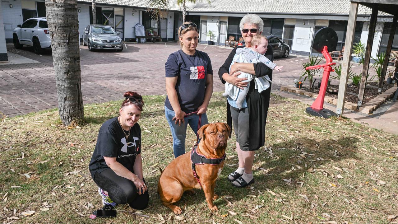 Angie, Cass Richardson with her dog Armani and Rose Brahimi with her grandson she is raising are staying in the emergency accommodation at Port Noarlunga Motel. Picture: Brenton Edwards