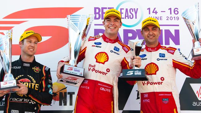 Holden driver Dave Reynolds (left) after coming third in Darwin earlier this month behind Ford drivers Scott McLaughlin (centre) and Fabian Coulthard (right). Picture: Getty Images