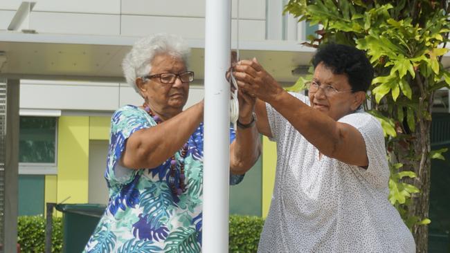 Eunice and Carmel Armstrong raised the South Sea Islander Flag at Mackay Hospital in a ceremony to recognise the valuable contribution of the Australian South Sea Islander community. Photo: Fergus Gregg