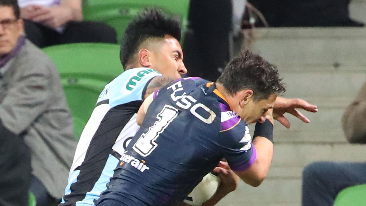 Billy Slater was cleared of a shoulder charge for this hit on Cronulla’s Sosaia Feki, freeing him to play in Sunday’s NRL grand final. Picture: Getty.