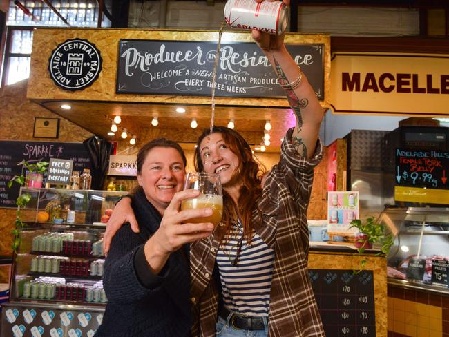 Rose Kentish, co-founder of Sparkke, and brewer Agi Gajic with their new apple cider at the central market. Photos: AAP Image/ Brenton Edwards