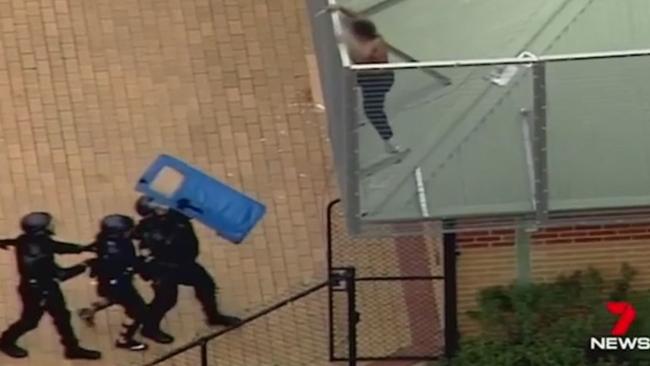 Police work to stop rioting at Melbourne Youth Justice Centre in Parkville.