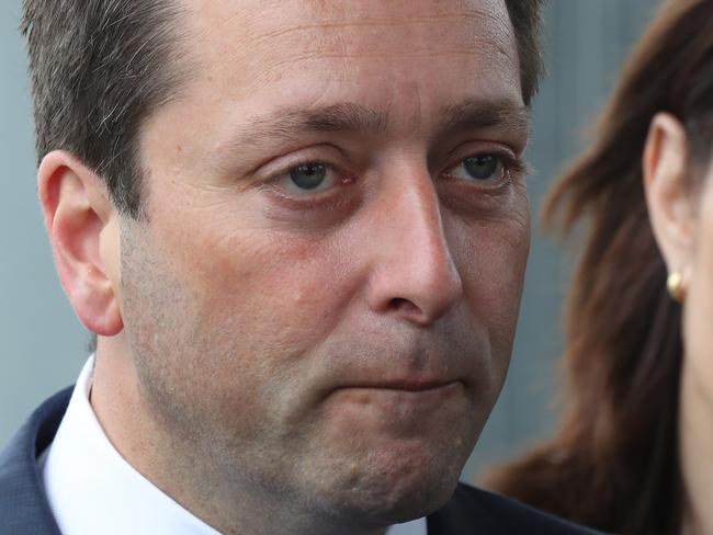 Victorian opposition Leader Matthew Guy with his wife Renae Guy at Cranbourne railway station in Melbourne, Friday, November 23, 2018. Victoria goes to the polls on Saturday for the state election. (AAP Image/David Crosling) NO ARCHIVING