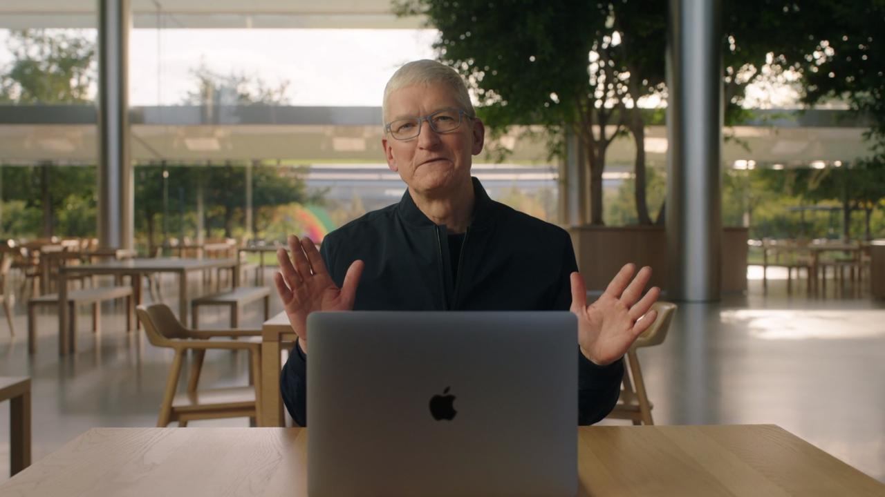 Apple CEO Tim Cook with one of the new MacBook computers using Apple’s M1 chip.