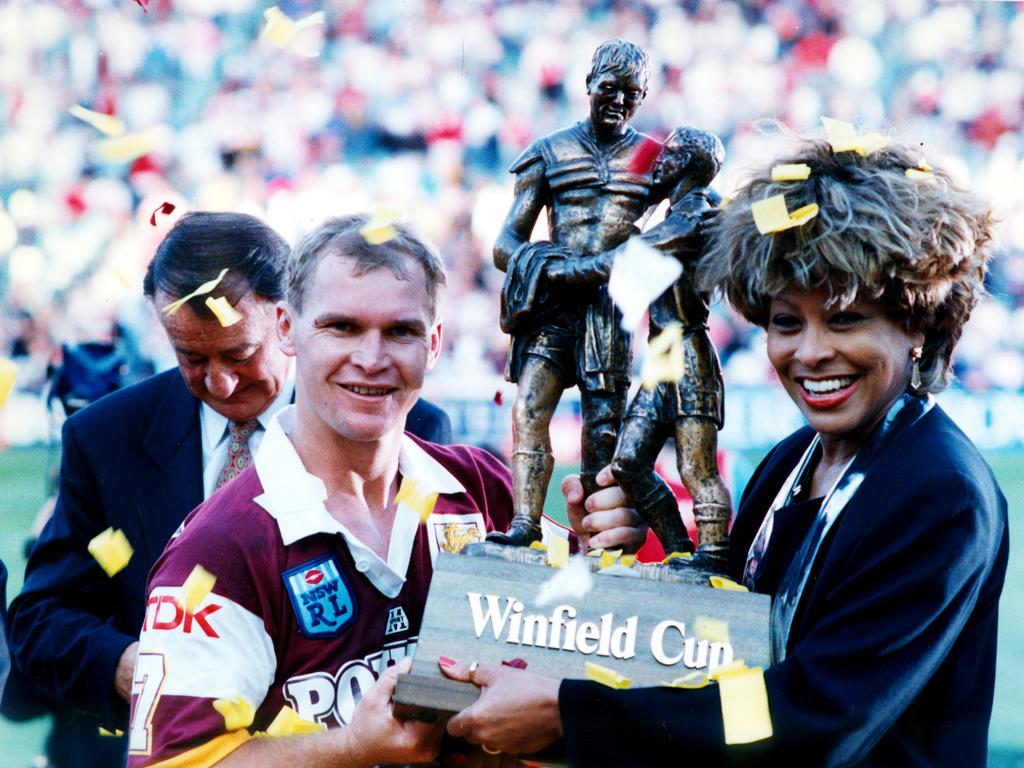 Alfie Langer and Tina Turner holding the Winfield Cup at the end of the 1993 Brisbane Broncos v St George Rugby League Grand Final at the SFS in Sydney.