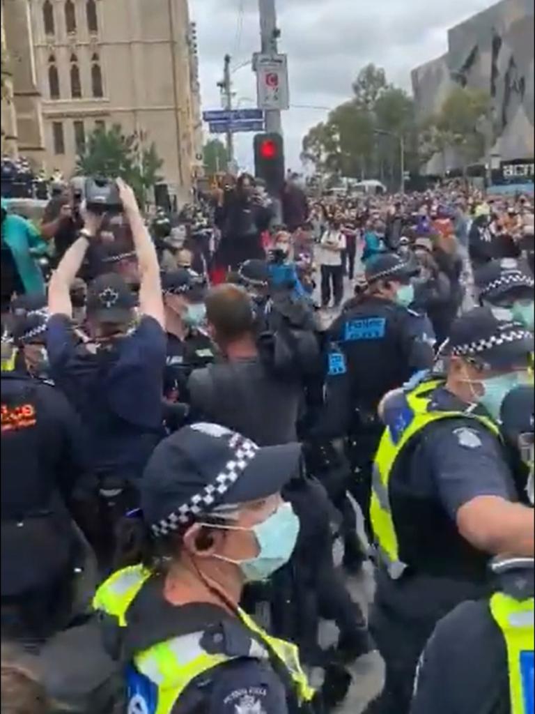 An Invasion Day protest on Tuesday was crashed by a counter-protester who was forcibly removed from the scene