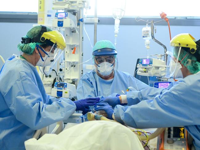 Members of the medical staff take care of a patient infected by coronavirus at the ASST Papa Giovanni XXIII hospital in Bergamo, Italy. Picture: AFP