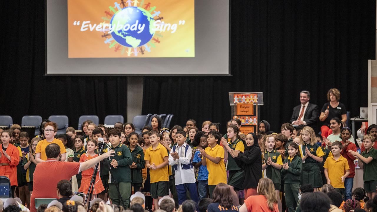 SING: Darling Heights State School choir sing on Harmony Day at the school’s annual parade. Pictures: Nev Madsen.