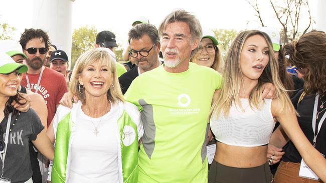 Olivia Newton-John, her husband John Easterling and her daughter Chloe Lattanzi, start the Olivia Newton-John Wellness Walk and Research Run at the Alexandra Gardens in Melbourne, Sunday, October 6, 2019. Picture: AAP