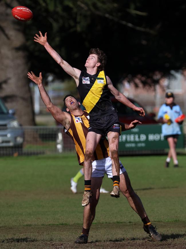 RDFNL: Lancefield’s Ben Sankey leaps of Tim Martin of Woodend-Hesket. Picture: Hamish Blair