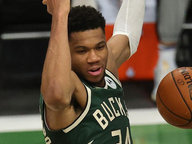 MILWAUKEE, WISCONSIN - JULY 11: Giannis Antetokounmpo #34 of the Milwaukee Bucks dunks against the Phoenix Suns during the second half in Game Three of the NBA Finals at Fiserv Forum on July 11, 2021 in Milwaukee, Wisconsin. NOTE TO USER: User expressly acknowledges and agrees that, by downloading and or using this photograph, User is consenting to the terms and conditions of the Getty Images License Agreement. (Photo by Jonathan Daniel/Getty Images)