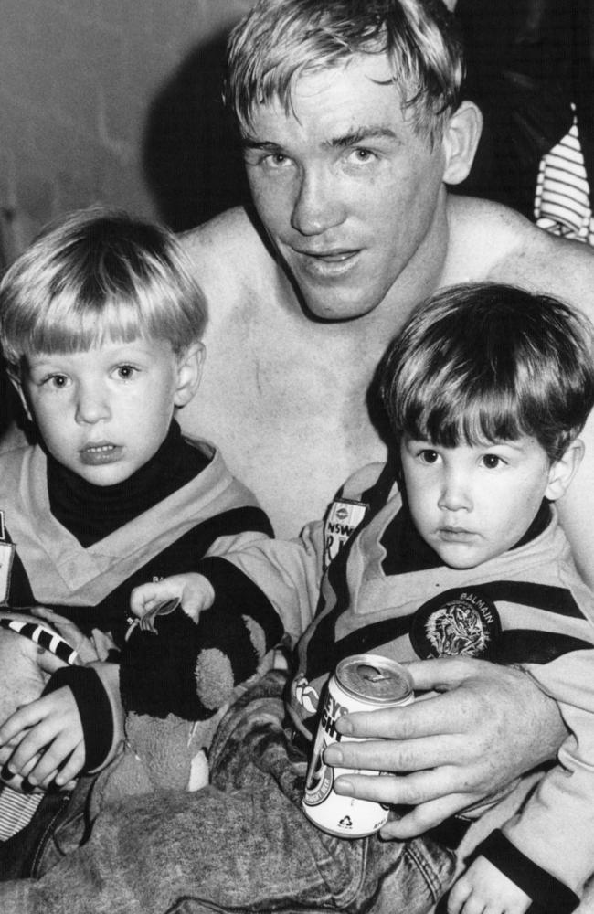 Kieran (left) with his father Garry and younger brother Rhys in the dressing room after a Tigers game in 1991. Pic Peter Kurnik.