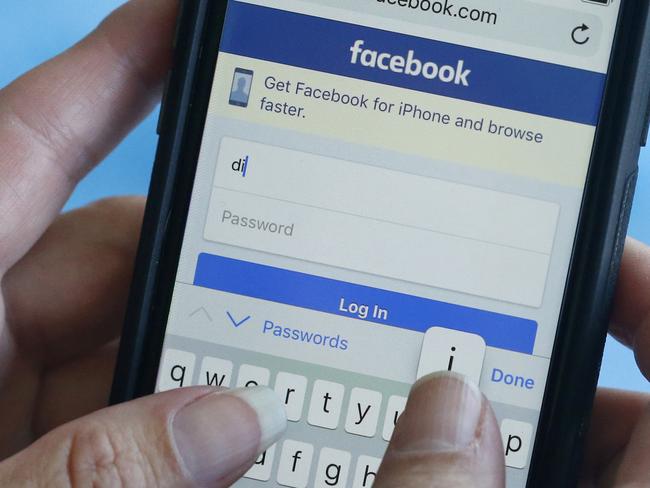 FILE - In this Aug. 21, 2018 file photo, a Facebook start page is shown on a smartphone in Surfside, Fla.  A growing number of people say they are deleting Facebook, or at least considering it. Before you take the plunge, remember to download your data, then, you can deactivate temporarily, or delete everything in a few steps.  (AP Photo/Wilfredo Lee, File)