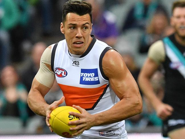 Dylan Shiel of the Giants controls the ball during the Round 18 AFL match between the Port Adelaide Power and the Greater Western Sydney (GWS) Giants at Adelaide Oval in Adelaide, Sunday, July 22, 2018. (AAP Image/David Mariuz) NO ARCHIVING, EDITORIAL USE ONLY