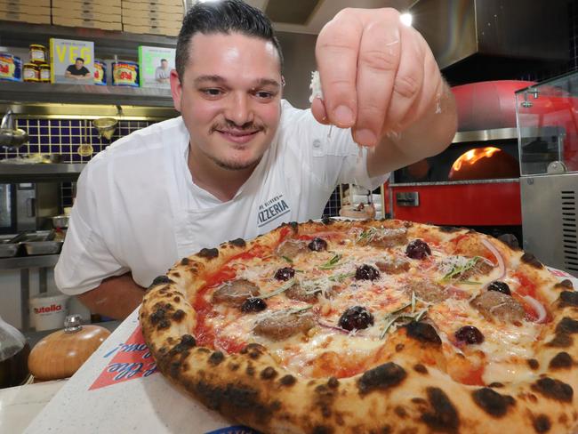 Jamie's Pizzeria Head Chef Stefano Mauro makes a Sausage Pizza, one of the new dishes from Jamies new cookbook. Picture Glenn Hampson