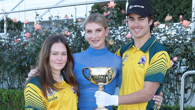 Melbourne Cup Tour ambassador Jamie Kah with Giselle and Gabe Smith. Picture: VRC