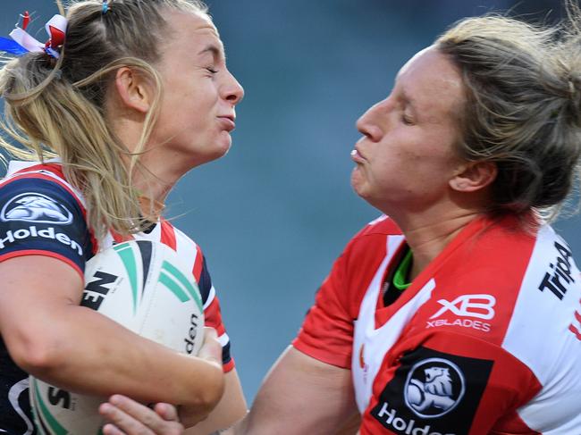 Brydie Parker of the Roosters (left) is tackled by Holli Wheeler of the Dragons during the NRL Women's Premiership match between the Sydney Roosters and the St George-Illawarra Dragons at Allianz Stadium in Sydney, Saturday, September 22, 2018. (AAP Image/Dan Himbrechts) NO ARCHIVING, EDITORIAL USE ONLY