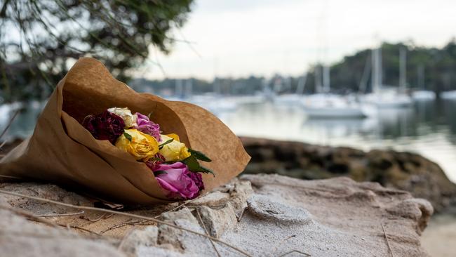 Floral tributes laid at Lane Cove River shoreline, at the end of Angelo St, Woolwich, near where Ms Haddad’s body was found.