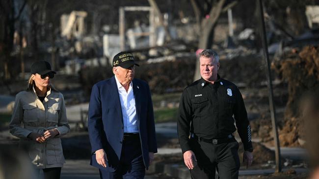 The Trumps are shown around decimated streets in the LA neighbourhood of Pacific Palisades Picture: Mandel Ngan / AFP