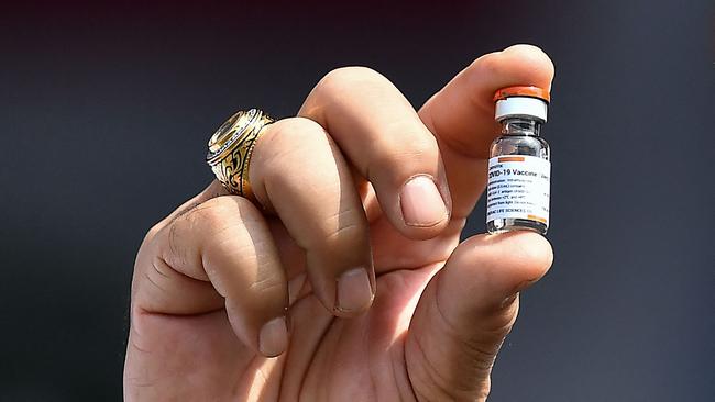 Thai Prime Minister Prayut Chan-O-Cha holds a vial of the Coronavac COVID-19 coronavirus vaccine, developed by China's Sinovac, on Wednesday. Picture: AFP