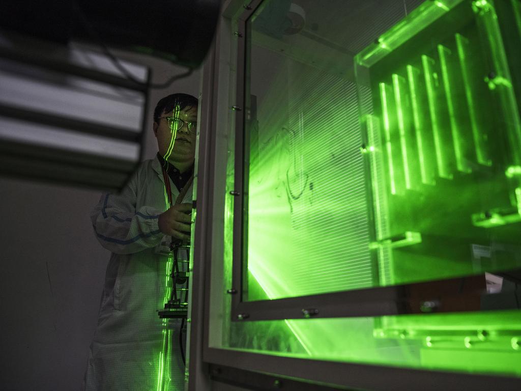 A Huawei thermal engineer performs a heat test. Picture: Getty