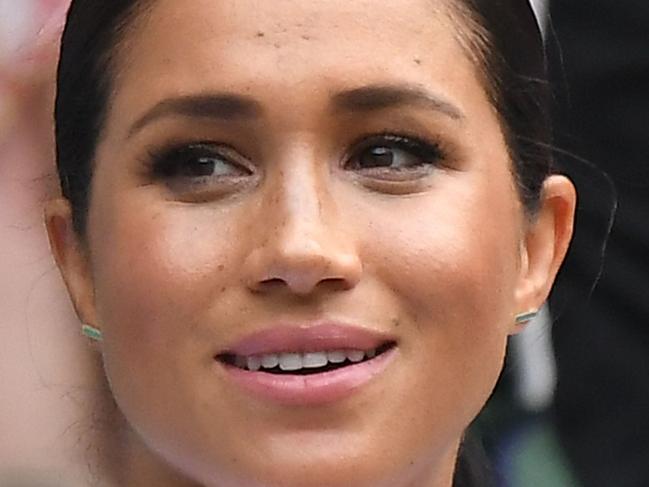 (FILES) In this file photo taken on July 13, 2019 Britain's Meghan, Duchess of Sussex, sits in the Royal Box on Centre Court to watch Romania's Simona Halep playing US player Serena Williams during their women's singles final on day twelve of the 2019 Wimbledon Championships at The All England Lawn Tennis Club in Wimbledon, southwest London, on July 13, 2019. - Meghan Markle has revealed she suffered a miscarriage in July this year, writing in the New York Times on November 25, 2020 of the deep grief and loss she endured with her husband Prince Harry. (Photo by Ben STANSALL / AFP) / RESTRICTED TO EDITORIAL USE