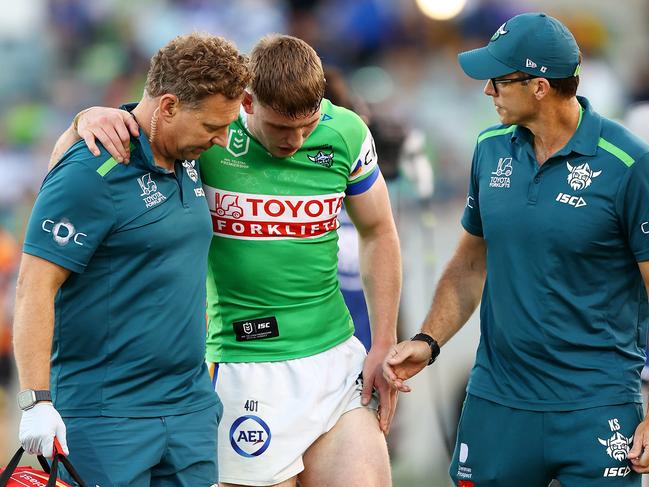 Matty Nicholson comes off late with an ankle injury. Picture: Mark Nolan/Getty Images