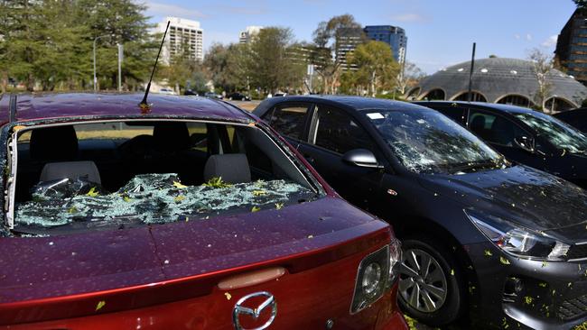 Hail damaged cars are seen parked outside the National Film and Sound Archive of Australia in Canberra.