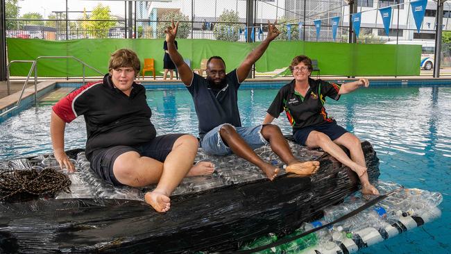 Peter, Ted and Carol Ayres jump aboard The Ironic to test how it floats. Picture: Pema Tamang Pakhrin