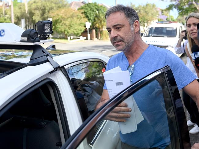 O’Keefe enters a taxi after speaking with reporters outside court. Picture: Jeremy Piper