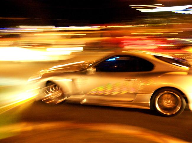 30/05/2003 PIRATE: MAY 25, 2003 : Street cars speed along the Gold Coast motorway, 25/05/03. Pic Lyndon Mechielsen. Queensland / Crime / Drag Racing / generic street racing  Pic. Lyndon Mechielsen