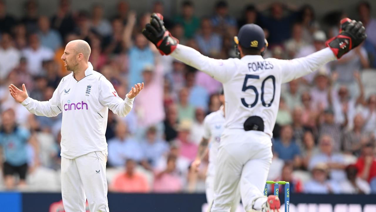 LEEDS, ENGLAND - JUNE 23: Jack Leach of England reacts after taking the wicket of Henry Nicholls of New Zealand as it came off the bat of New Zealand's Daryl Mitchell at the non-strikers end during Day One of the Third LV= Insurance Test Match between England and New Zealand at Headingley on June 23, 2022 in Leeds, England. (Photo by Alex Davidson/Getty Images)