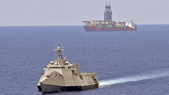 USS Gabrielle Giffords patrols near the West Capella on Tuesday after the drillship was harassed by a Chinese survey ship. Picture: US Navy
