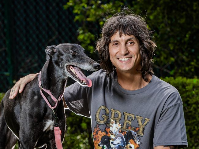 Indy Davies has directed a film exploring the systematic issues plaguing the greyhound racing industry. He is bringing the film to Adelaide next Thursday. Indy Davies with his greyhound Georgie.Picture: Nigel Hallett