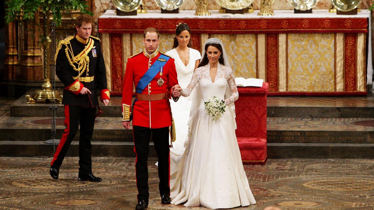 <b>2011: </b>Prince Harry acts as best man as brother Prince William ties the knot with Kate Middleton, who adopts the title of Princess Catherine. The trio formed a close bond that would last years before their relationship deteriorated. Picture: AFP