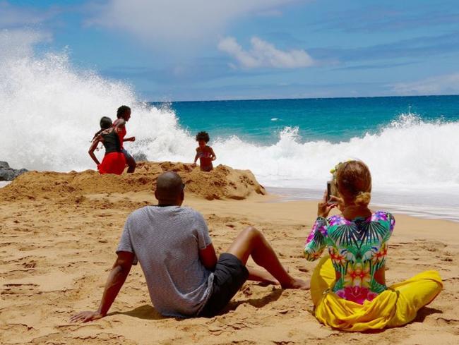 Bey uses a smartphone to take a picture of her kid while a professional photographer takes a picture of her. S**t is meta. Picture: Beyonce.com