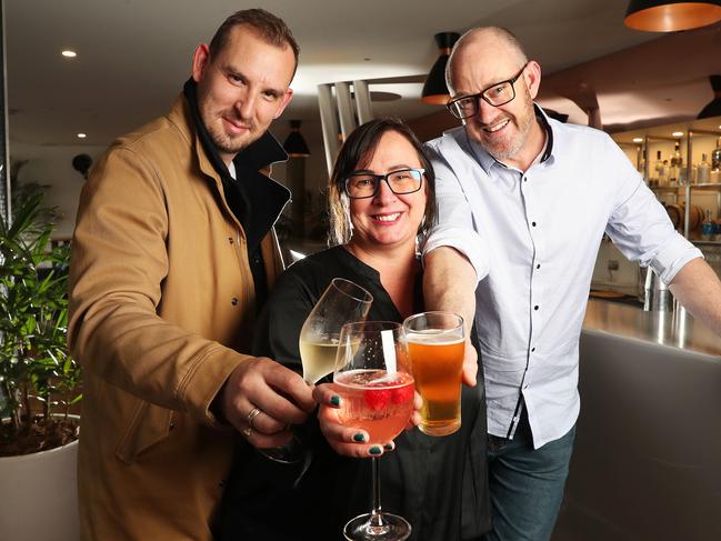 T42 general manager Alex Watson, who has had experience with Gordon Ramsay in London and the Glass House, with the popular Elizabeth Street Pier tavern’s new owners Amelia and Leo Miller. Picture: Nikki Davis-Jones