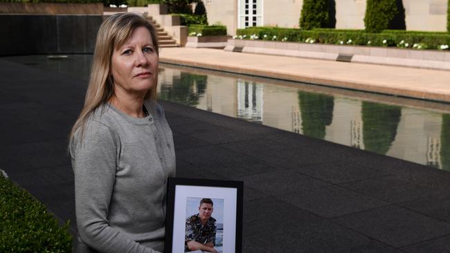 Julie Anne Finney holds an image of her son David at the Australian War Memorial in Canberra. Picture: Tracey Nearmy/Advertiser