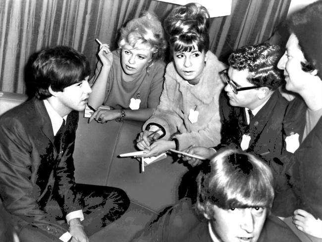 Blanche D'Alpuget (2nd L smoking cigarette) and Christine Crocker (3rd L) meet singer Paul McCartney in Sydney.