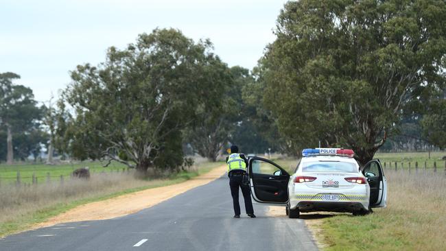 Police monitor the state border on Mingbool Rd, Pleasant Park. Picture: Tait Schmaal