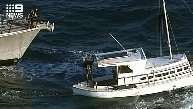 Boaties Tony Higgins and Derek Robinson are towed by SA Police. Picture: Nine News Adelaide