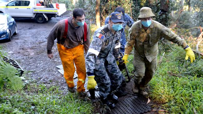 Defence personnel delivering generators to households in Olinda, which remain without power after the storm. Picture: Andrew Henshaw