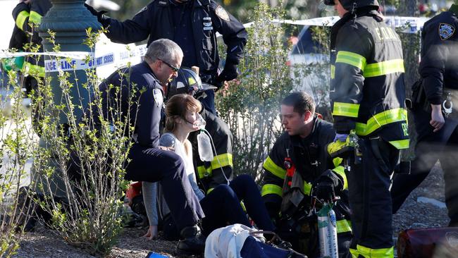 A woman is aided by first responders after being injured in the New York terror attack.